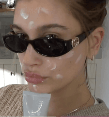 HB holding barrier butter, with a splashes of cream on her face
