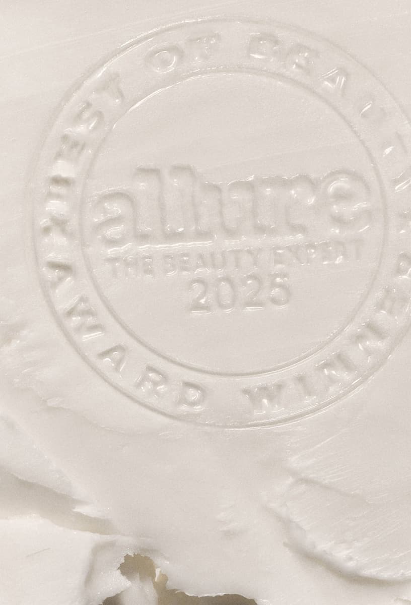 allure best of beauty 2025 badge imprinted on a swatch of barrier butter