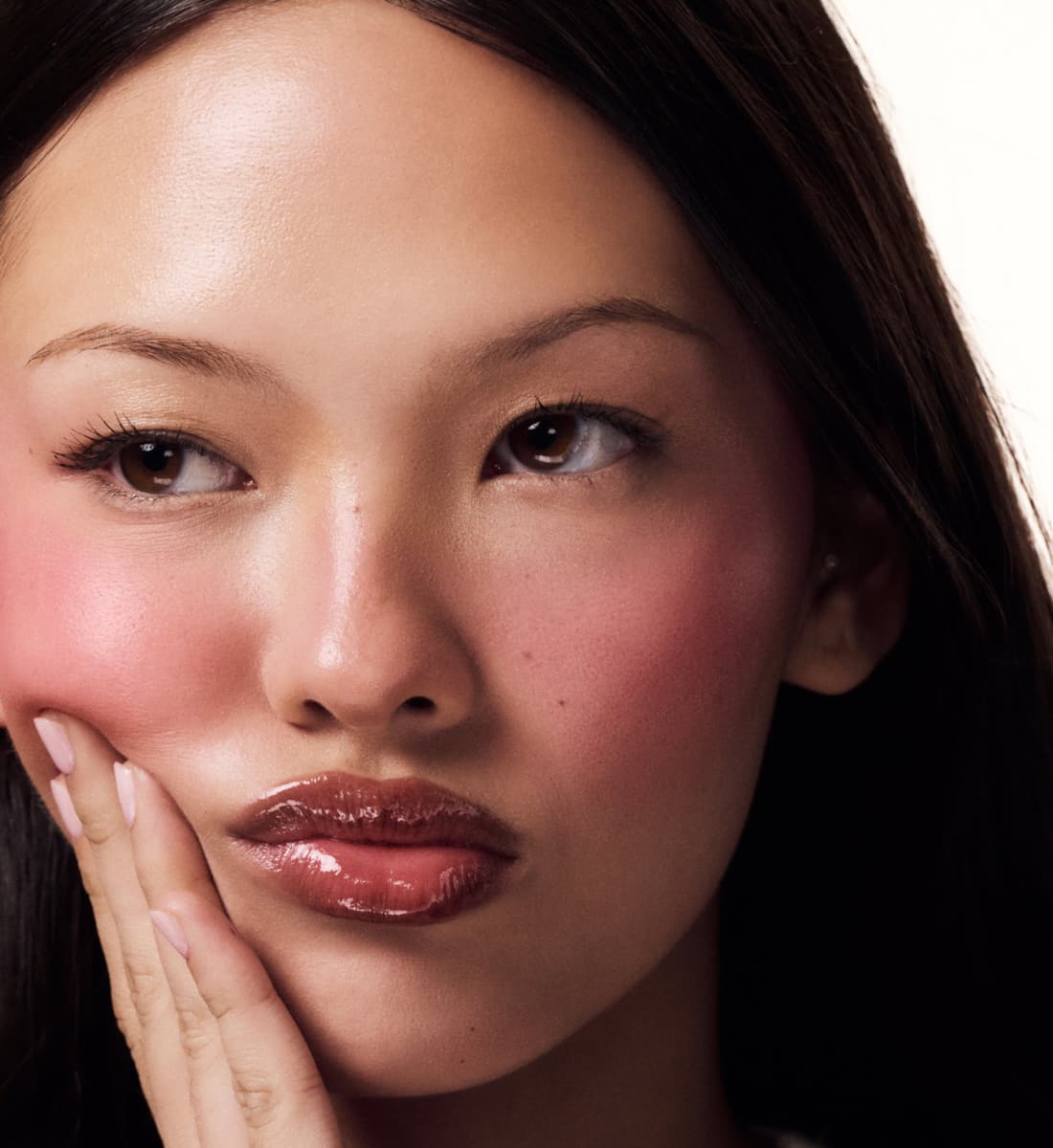 model wears pocket blush and peptide lip tint pbj