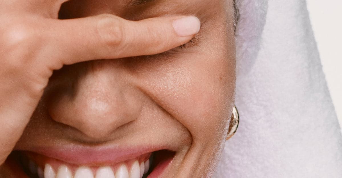 model after cleansing her face with pineapple refresh