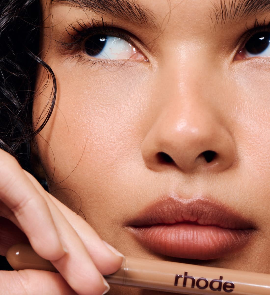 model holding a peptide lip shape