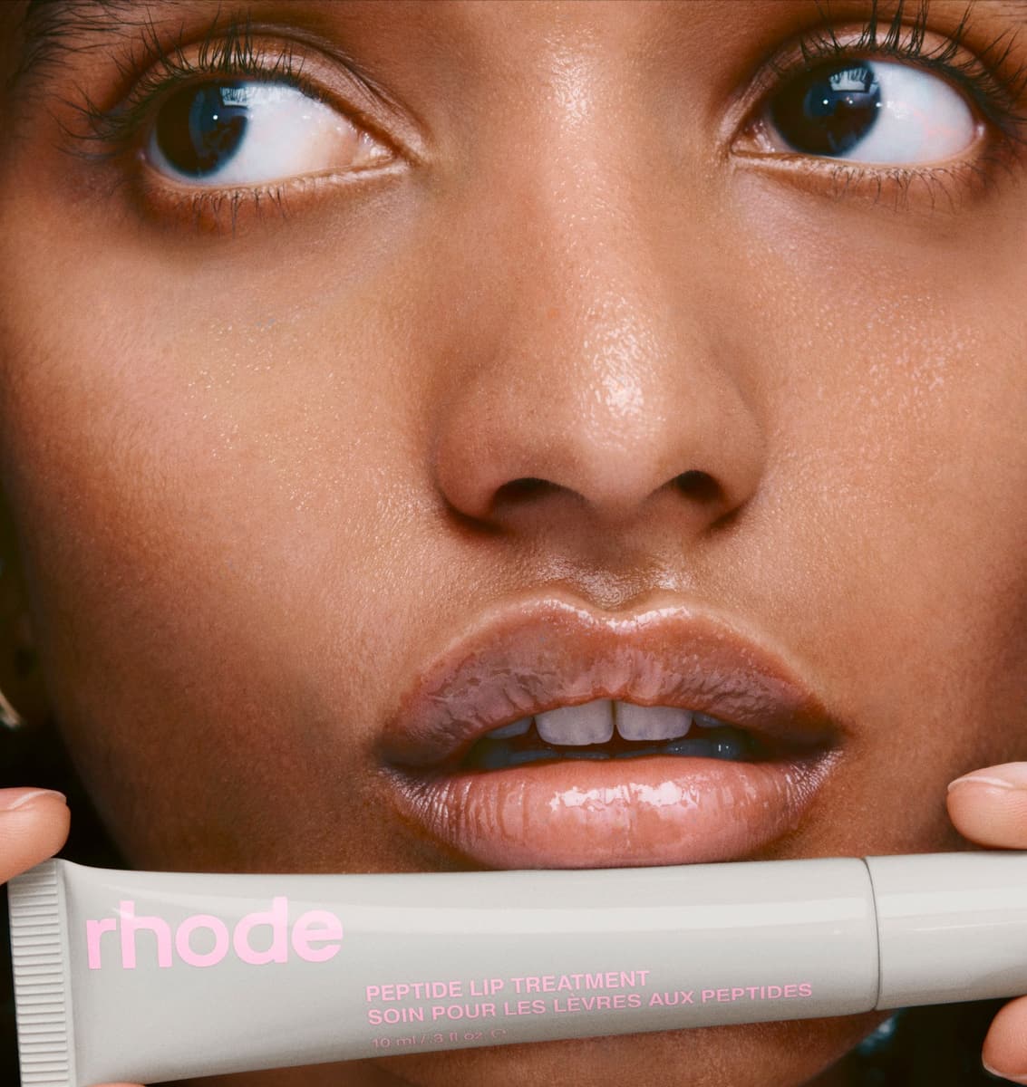 model holding peptide lip treatment in rhode vanilla