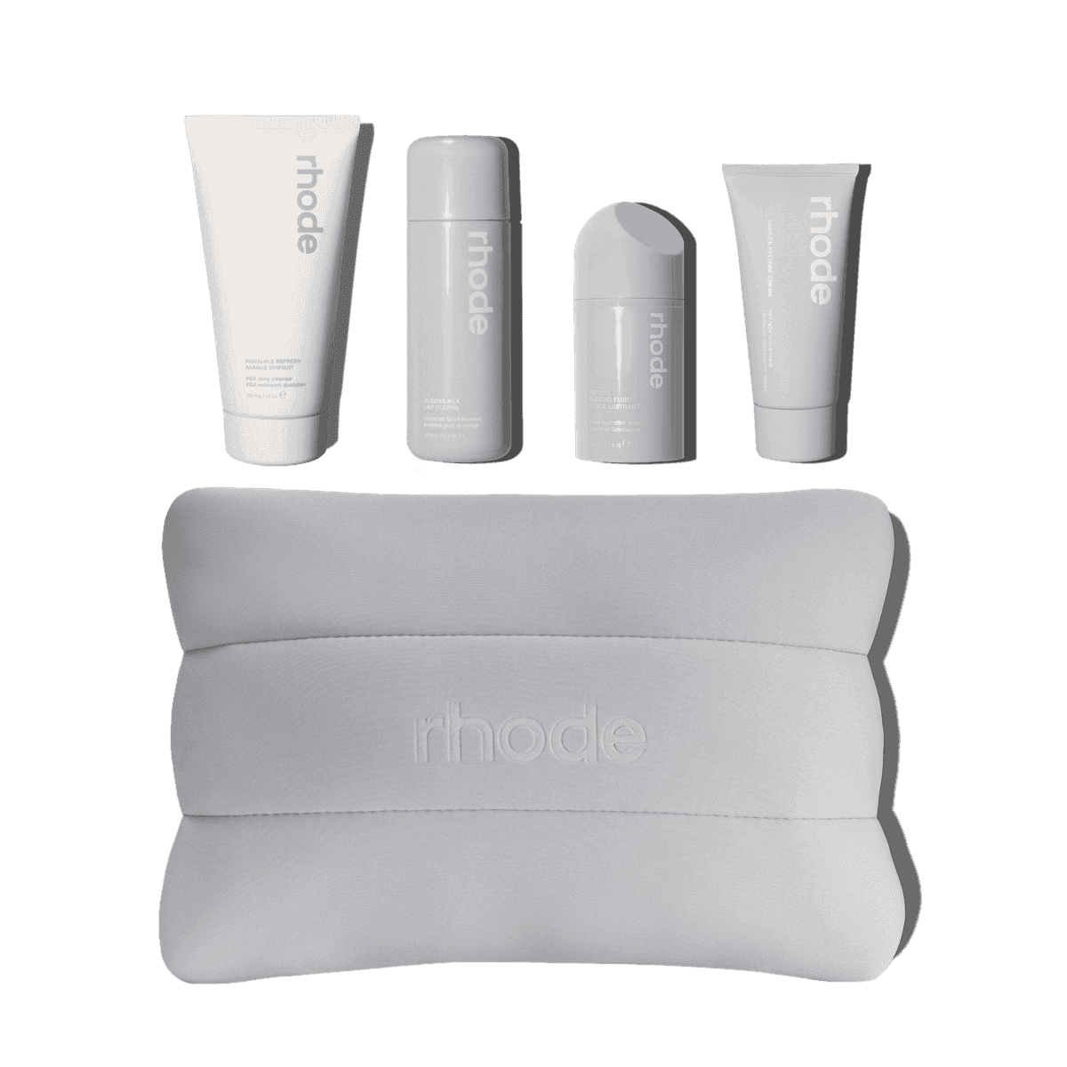 The rhode kit includes Pineapple Refresh, Glazing Milk, Peptide Glazing Fluid, Barrier Restore Cream bundled up in a rhode bubble bag.